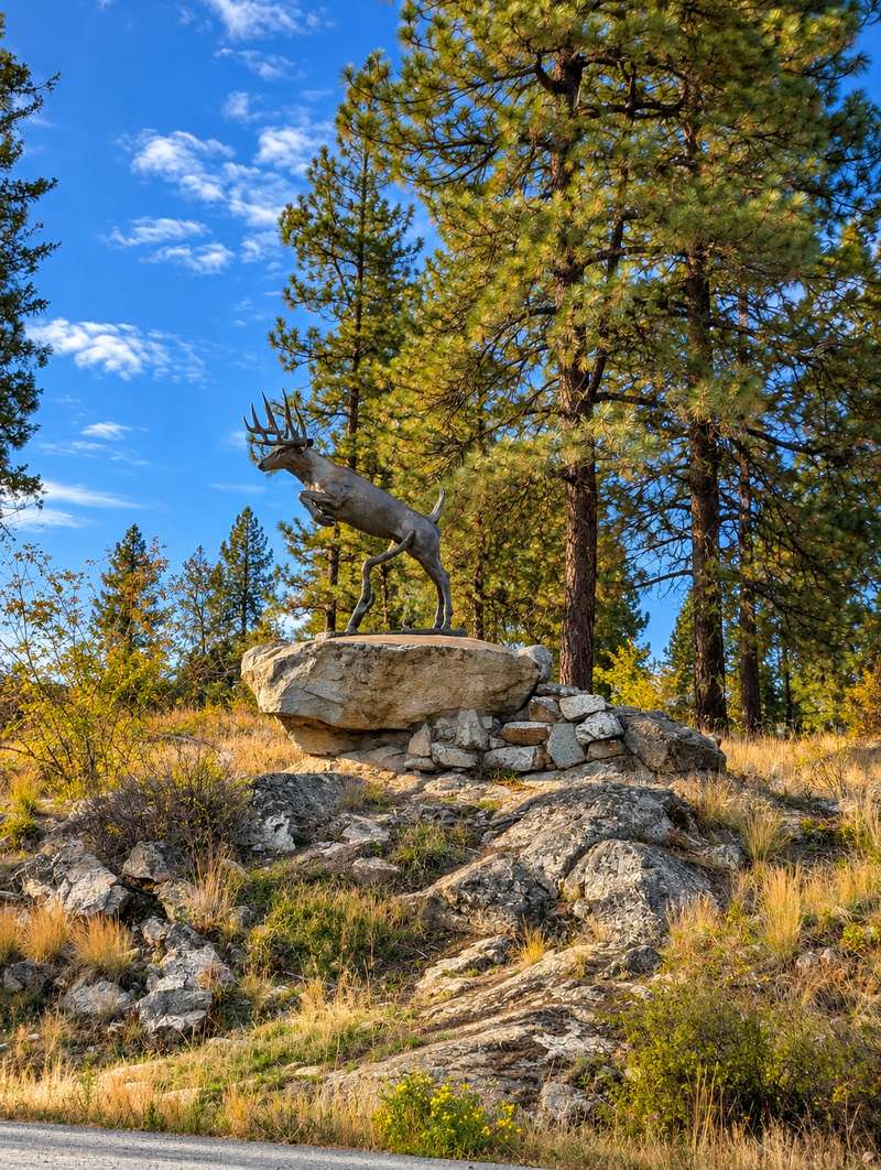 Leaping buck statue on a rock above Black Tail Rd, Anarchist Mountain, Osoyoos BC