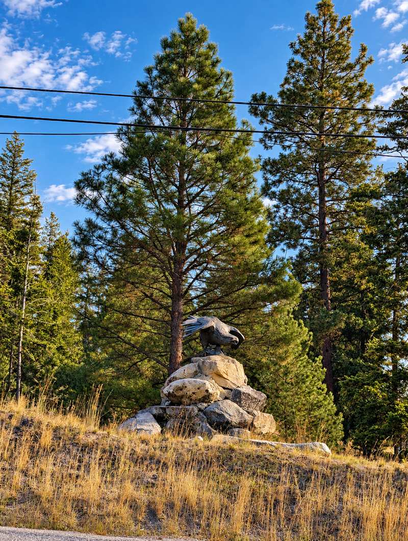 Eagle statue with spread wings on a rock pile at Eagle Point, Anarchist Mountain, Osoyoos BC