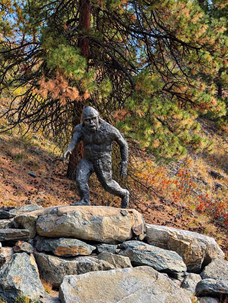 Sasquatch statue on rocks on Sasquatch Trail, Anarchist Mountain, Osoyoos BC